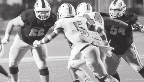Junior Caden Thrift (66) and senior Hayden Waldrip (54) block in the fourth quarter of last week’s playoff game as the previously undefeated Badgers attempted a 19-point comeback. JEFF LOWE | DISPATCH RECORD