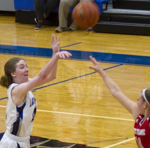 Taylor Allen knocks down a three-pointer from about 24 feet out to bring Lampaas within two points of Glen Rose. Later, she tipped in the game-tying basket at the end of regulation. JEFF LOWE | DISPATCH RECORD