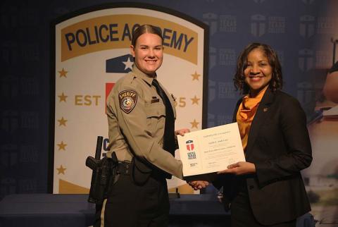 Central Texas College Police Academy Cadet Faith Anderson receives her graduation certificate from Central Texas College Chancellor Dr. Michele J. Carter. Anderson is the newest deputy at the Lampasas County Sheriff’s Office. COURTESY PHOTO