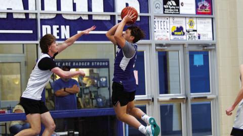 HUNTER KING | DISPATCH RECORD Dylan Polmanteer shoots over the outstrectched hand of a Lago Vista defender.