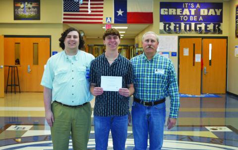 Cale Wheeler, in center, holds his National Merit Scholarship Finalist certificate. With him are his brother, Cole Wheeler, at left, and father Shawn Wheeler. ERICK MITCHELL | DISPATCH RECORD