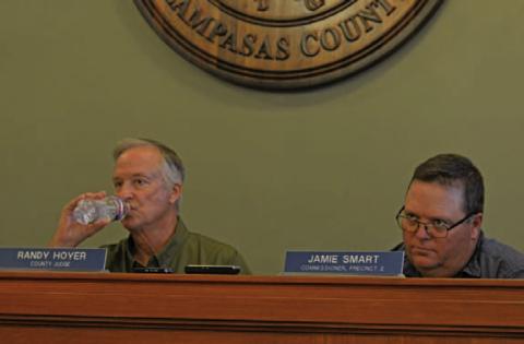County Judge Randy Hoyer, at left, and Precinct 2 Commissioner Jamie Smart during Monday’s meeting. ERICK MITCHELL | DISPATCH RECORD