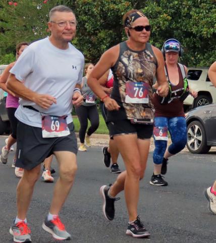 Steve McDaniel, left, runs in the Navidad Valley Cattlewoman’s Ranch Run in Schulenburg. COURTESY PHOTO | KAYE MCDANIEL