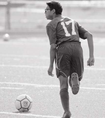 Zimri Vergara moves the ball down field on Monday. Vergara scored once against the Eagles. JEFF LOWE | DISPATCH RECORD