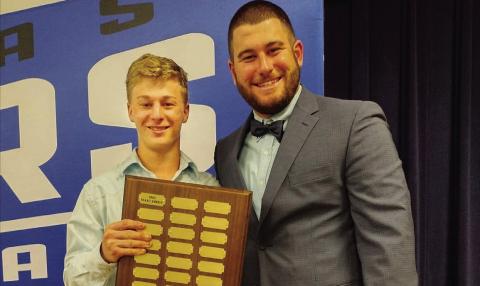 Isaac Abken, left, holds the Battlin’ Badger award next to head coach Samuel Burnside. COURTESY PHOTO | SAMUEL BURNSIDE