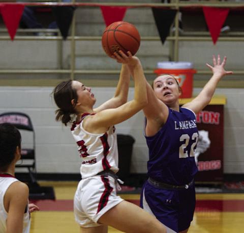 Kenedi Smart blocks a shot during the second half of Tuesday’s game. HUNTER KING | DISPATCH RECORD