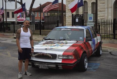 Lampasas resident Robert Sanzhez stands next to his 1991 Buick Century outside the Lampasas County Courthouse. The Mexican coat of arms that is present on the Mexican flag of a golden eagle eating a rattlesnake can be seen on the hood of the car. ERICK MITCHELL | DISPATCH RECORD