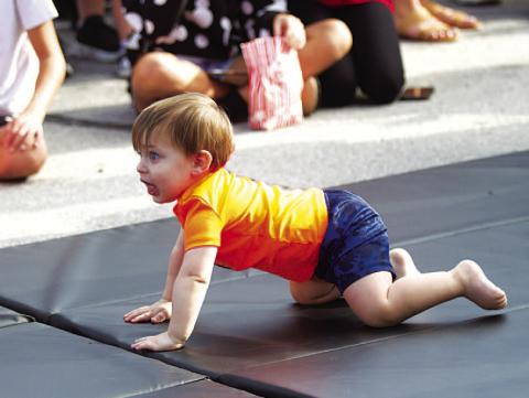Nash Ingram participates in a previous Diaper Derby. FILE PHOTO