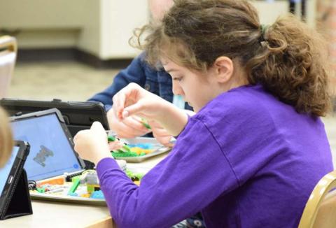 Isabella Gutierrez builds an earthquake simulation plate out of LEGO blocks using step-by-step instructions. ALEXANDRIA RANDOLPH | DISPATCH RECORD