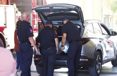 HUNTER KING | DISPATCH RECORD Lampasas Fire Department served as an emergency water station Wednesday. Residents could pick up bottled water, and a limited supply of non-potable water also was offered to those in need.