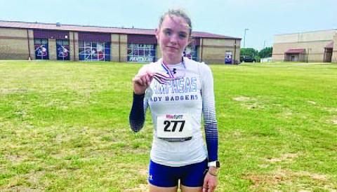 COURTESY PHOTO | LAMPASAS ATHLETICS FACEBOOK Teagan Reiss poses with her second-place medal from the regional track meet last week.