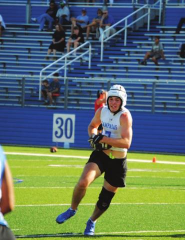Carter Johnson runs up the middle of the field in Monday’s game. HUNTER KING | DISPATCH RECORD