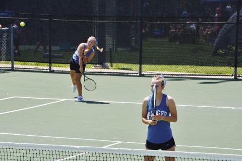 Sydney Unger (back) and Taylor Sheard compete at the regional tennis tournament last week. COURTESY PHOTO | KENNETH PEISER