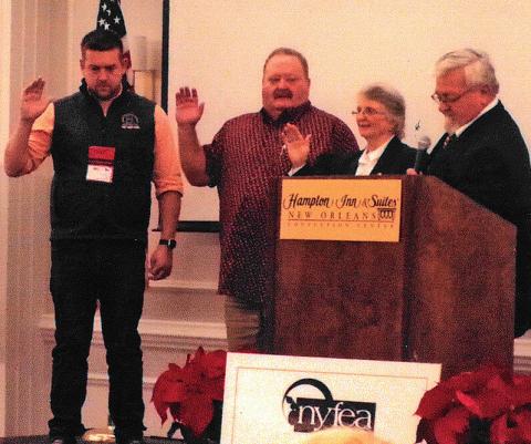 Clovia Ketchum, second from right, is sworn in as president of the National Young Farmers Education Association. Also installed were, from left, James Wood of Indiana, secretary; and Rusty Tipton of Kentucky, president-elect. Handling the officer installation is Donnie Carter of Georgia, past president of NYFEA. courtesy photo