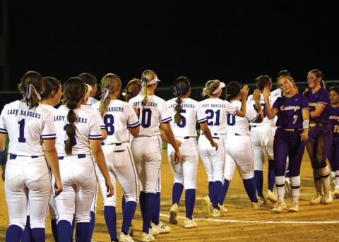 The Lady Badgers shake hands with the Lady Mustangs after the Lampasas win. HUNTER KING | DISPATCH RECORD