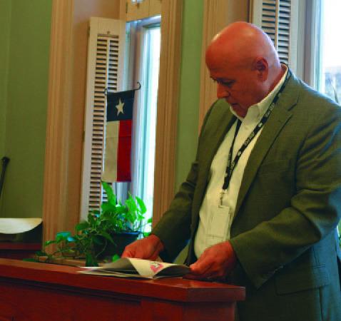 Hill Country Transit General Manager Raymond Suarez looks at his presentation notes while speaking to the Lampasas County Commissioners Court in the meeting Sept. 9. Suarez outlined the new structure for the regional transportation service. ERICK MITCHELL | DISPATCH RECORD