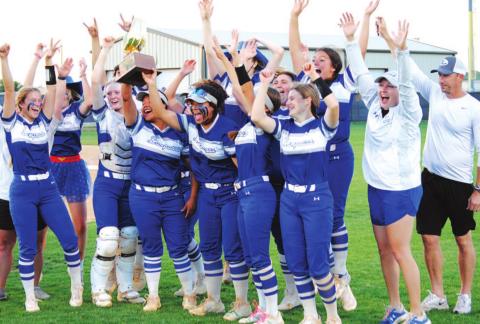 The Lady Badgers celebrate with their bi-district championship trophy after beating Graham last Friday night. HUNTER KING | DISPATCH RECORD