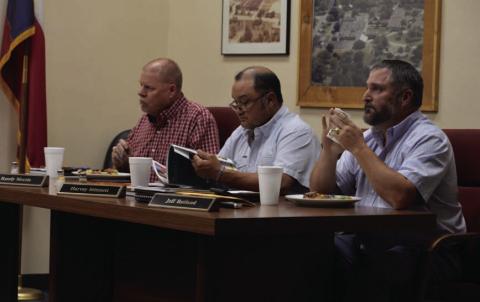 Trustees, from left to right, Randy Morris, Harvey Stinnett and Jeff Rutland enjoy meals prepared by Lampasas High School culinary arts students before Monday’s school board meeting. ERICK MITCHELL | DISPATCH RECORD