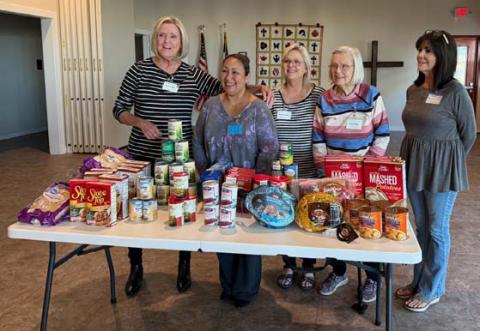The ’36 Club took up Thanksgiving donations for a November community service project. Pictured with the food donations are Projects Committee members. Courtesy photo