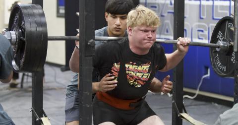 Brody Hilgenberg pushes up weight during the squat portion of the Badgers’ home powerlifting meet on Thursday. HUNTER KING | DISPATCH RECORD