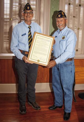 Post Adjutant John Fingerhut, left, and Post Chaplain Harry Hollister display the charter that officially recognizes the renaming of the Briggs Wright Post No. 277. MARTIN RODRIGUEZ | COURTESY PHOTO