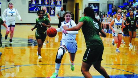 Aspen Wheeler drives in for a layup against Taylor. HUNTER KING | DISPATCH RECORD