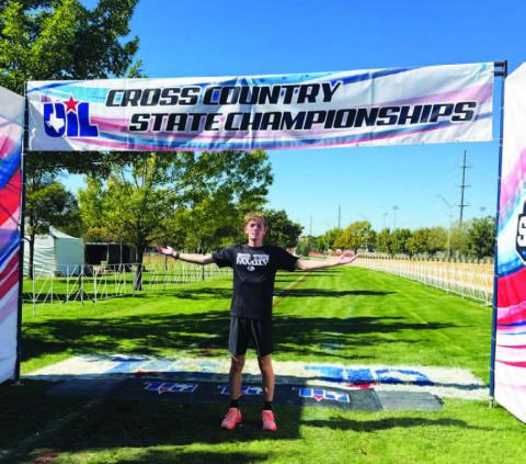 COURTESY PHOTO | KIM BURNSIDE John Keyes poses for a photo at the finish line of the state cross country meet.