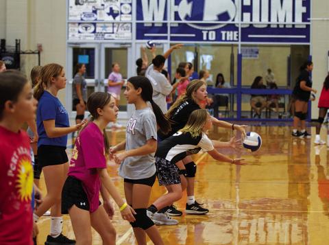 Young Lady Badgers work on their serving at volleyball camp on Wednesday. HUNTER KING | DISPATCH RECORD