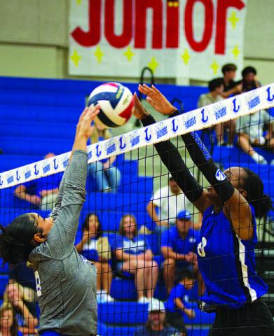 Angelina Davis leaps to challenge for a ball against Jarrell. HUNTER KING | DISPATCH RECORD