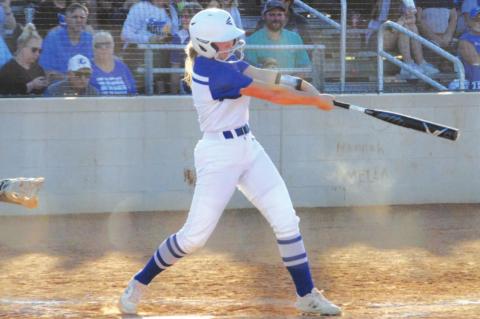 Kamryn Kothmann swings at a pitch during the Lady Badgers’ game last week against Brownwood. HUNTER KING | DISPATCH RECORD