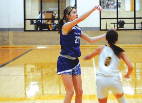 Payton Tatum rises up over a Gatesville defender for a three-point shot in the Lady Badgers’ win last Friday. HUNTER KING | DISPATCH RECORD