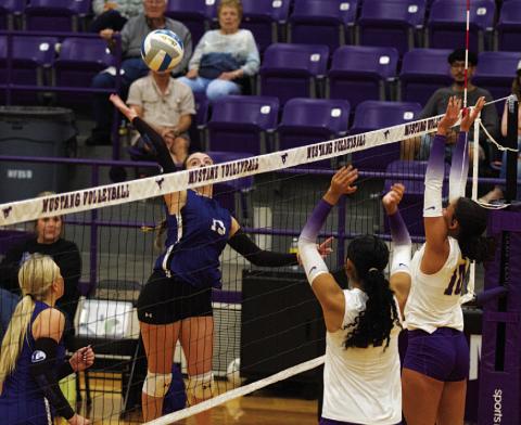 HUNTER KING | DISPATCH RECORD Abbey Green swings for a kill through the Marble Falls block during the first set in the girls’ second-to-last match this season.