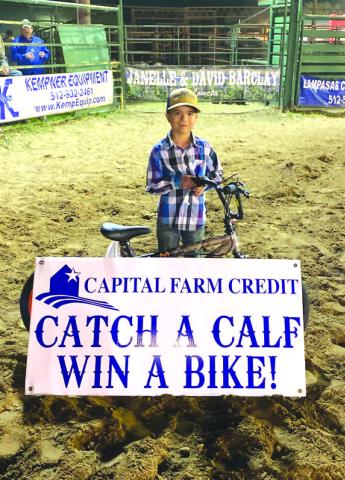 Gabriel Moore won the 6 and under calf scramble on March 25 at the Lometa Diamondback Jubilee Rodeo. He earned a bike for his efforts. The event was sponsored by Capital Farm Credit. COURTESY PHOTO | MARCUS AMTHOR