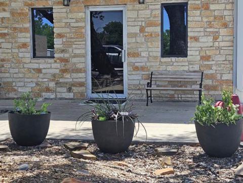 Browning Community Garden Club members have placed decorative planters in the flower bed at the Kempner Volunteer Fire Department building as part of a beautification project in honor of National Garden Week. COURTESY PHOTO