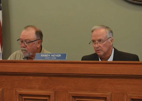 Precinct 3 Commissioner Shad Hill, left, and County Judge Randy Hoyer listen to a presentation Monday about eligibility for Lampasas County to receive some funding from the Federal Emergency Management Agency. erick mitchell | dispatch record