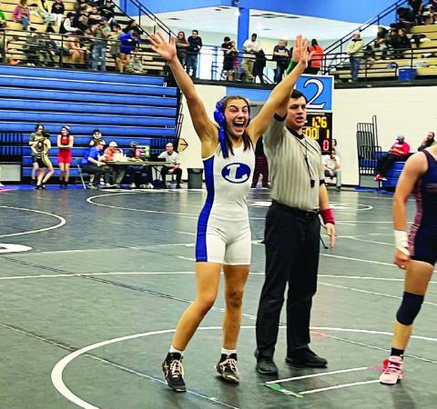 COURTESY PHOTO | LHS WRESTLING TWITTER Charlie Freese celebrates her match win at the district competition last week.