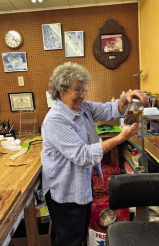 Wilma Loughmiller examines a preserved specimen in her workshop. She has received dozens of awards for her taxidermy pieces, but recognition has never been a motivation for her. Excellence in her craft and investing her time in others is how she has preferred to spend her life. JOYCESARAH MCCABE | DISPATCH RECORD
