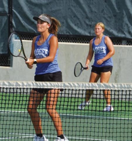 Caroline White, front, and Sydney Unger await a serve during their doubles match against Leander last week. COURTESY PHOTO | KENNETH PEISER