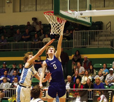Peyton Sisson finishes at the rim over a China Spring defender. HUNTER KING | DISPATCH RECORD