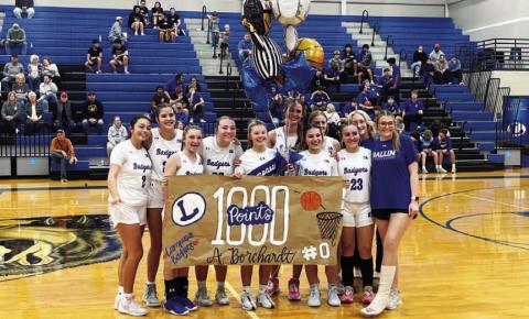 The girls’ basketball team celebrated Addison Borchardt reaching 1,000 career points ahead of a home game last week. HUNTER KING | DISPATCH RECORD