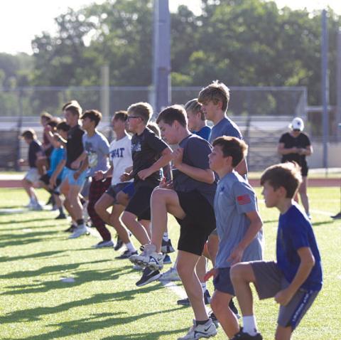 HUNTER KING | DISPATCH RECORD Young Badgers put in work on the high school football field last week.