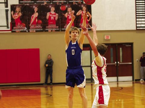 Peyton Sisson shoots over an outstretched hand for one of his three-point shots against Salado. HUNTER KING | DISPATCH RECORD