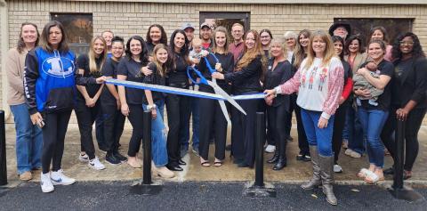 Radiance Clinical Research celebrated its first anniversary Dec. 13 with an open house and ribbon-cutting event. Dr. Vanna Gold and Mia Monroe hold the ceremonial scissors, with colleague Lauren Garner standing to their left. The three women are co-owners of the medical facility, located at 207 West Avenue E in Lampasas.