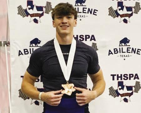 Aaron Everts shows off his medal for fifth place at the state powerlifting meet last weekend. COURTESY PHOTO