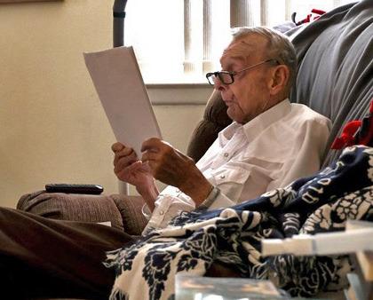 The late Ray Fitzgerald reads through the manuscript “The Soul of a Cowboy.” He was a top hand, a poet, served our country as a Marine and treated his horses well. joycesarah mccabe | dispatch record