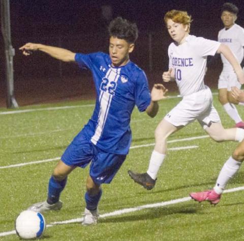 Cruz Lucio (22) moves the ball against the Florence defense. JEFF LOWE | DISPATCH RECORD