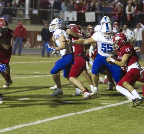 Conner Keele prepares to make a tackle on the Fredericksburg ball carrier Jesse Leija during last week’s contest. HUNTER KING | DISPATCH RECORD