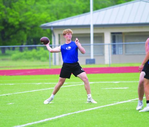 Ross Kothmann throws a pass during team workouts on Wednesday afternoon. HUNTER KING | DISPATCH RECORD