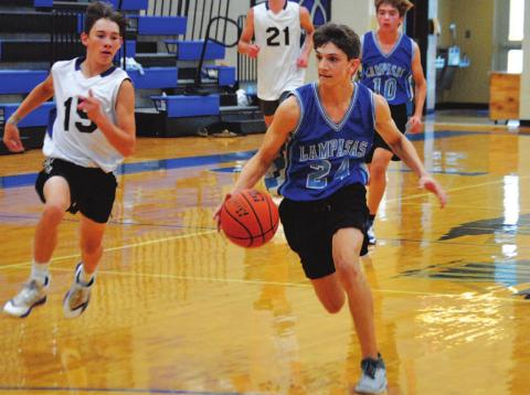 Luke Shivers dribbles to the basket for a layup during the Badgers’ first summer game against San Saba. HUNTER KING | DISPATCH RECORD