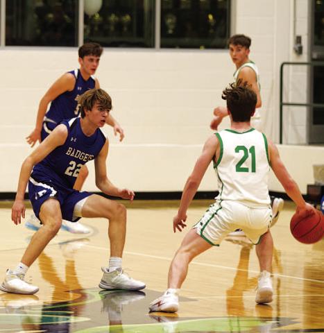 HUNTER KING | DISPATCH RECORD Jax Pratus defends the Burnet ball handler during Tuesday’s win over the Bulldogs.